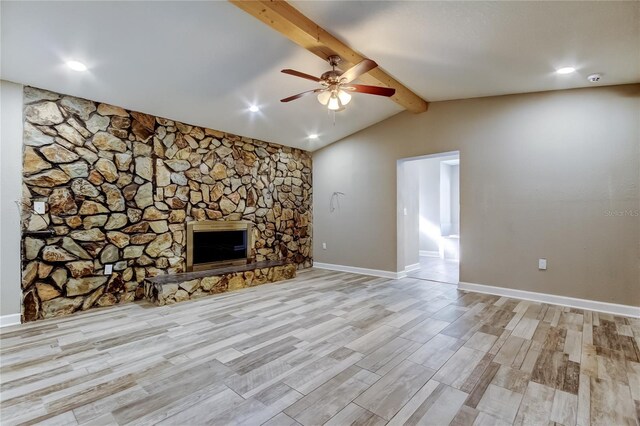 8330 Lafitte Dr, Hudson, FL 34667 - unfurnished living room featuring a ceiling fan, light wood-type flooring, a stone fireplace, baseboards, and recessed lighting