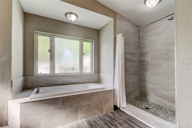 8330 Lafitte Dr, Hudson, FL 34667 - full bath featuring a garden tub and a tile shower