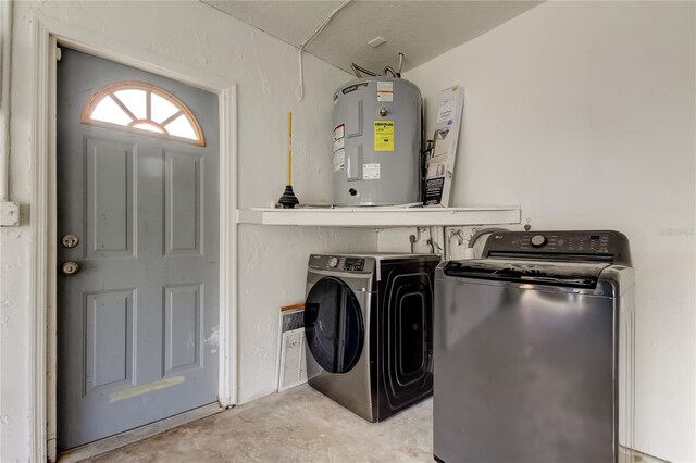 8330 Lafitte Dr, Hudson, FL 34667 - laundry room with water heater and washer and clothes dryer