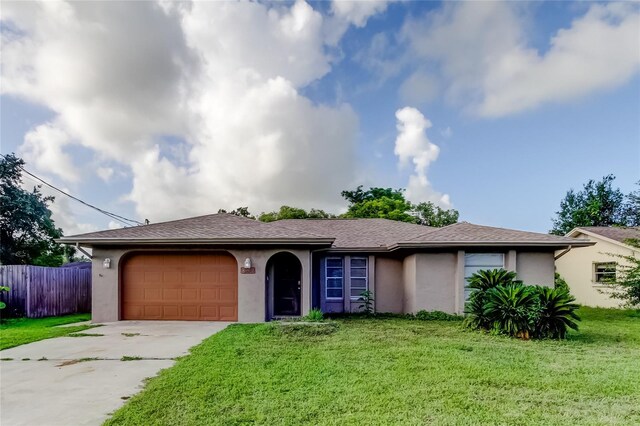8330 Lafitte Dr, Hudson, FL 34667 - single story home with stucco siding, an attached garage, concrete driveway, and a shingled roof