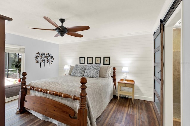 2806 Fairway View Dr, Valrico, FL 33596 - bedroom with a barn door, wood finished floors, ornamental molding, a ceiling fan, and wood walls