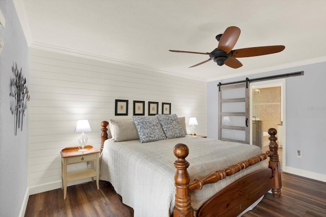 2806 Fairway View Dr, Valrico, FL 33596 - bedroom with a barn door, ornamental molding, wood finished floors, a ceiling fan, and wooden walls