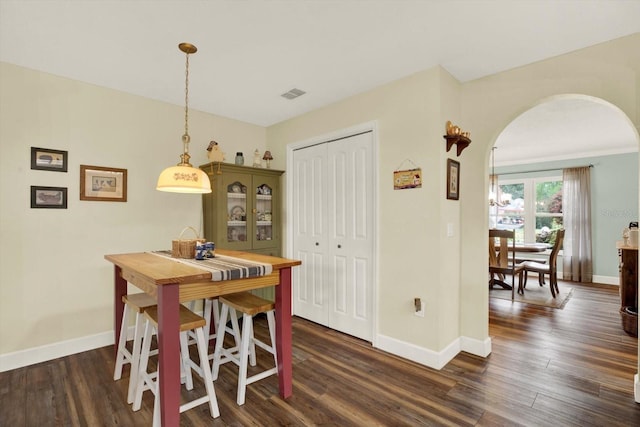 2806 Fairway View Dr, Valrico, FL 33596 - dining space featuring arched walkways and dark wood-type flooring