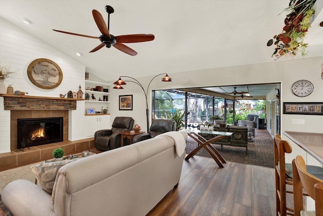 2806 Fairway View Dr, Valrico, FL 33596 - living room with dark wood-type flooring, a ceiling fan, vaulted ceiling, a fireplace, and recessed lighting