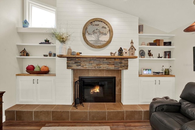 2806 Fairway View Dr, Valrico, FL 33596 - living room with wood finished floors, lofted ceiling, and a fireplace