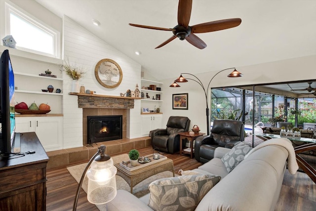 2806 Fairway View Dr, Valrico, FL 33596 - living room with wood finished floors, ceiling fan, healthy amount of natural light, a tile fireplace, and high vaulted ceiling
