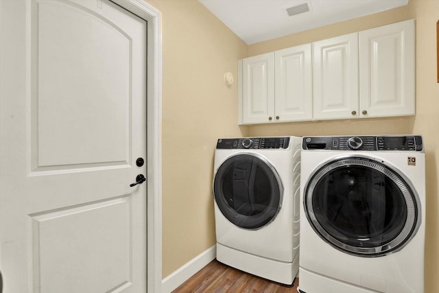 2806 Fairway View Dr, Valrico, FL 33596 - laundry area with cabinet space, independent washer and dryer, and wood finished floors