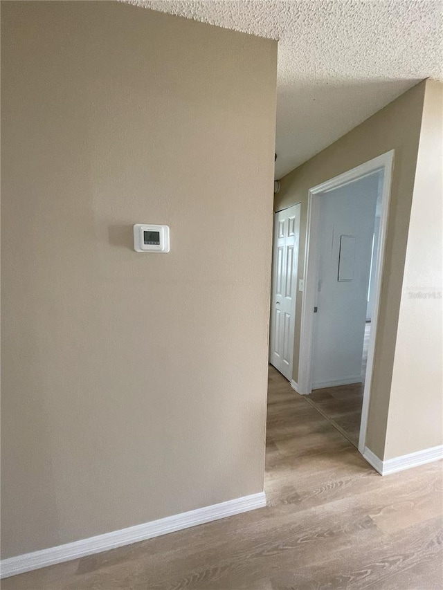 3007 Wainwright Ct, New Port Richey, FL 34655 - hallway with wood finished floors and baseboards
