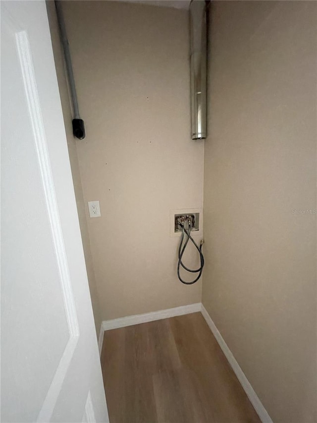 3007 Wainwright Ct, New Port Richey, FL 34655 - laundry room featuring washer hookup, wood finished floors, and baseboards