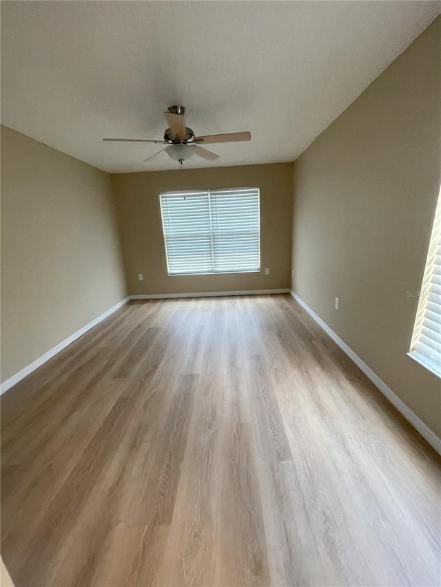 3007 Wainwright Ct, New Port Richey, FL 34655 - unfurnished room with ceiling fan, wood finished floors, and baseboards