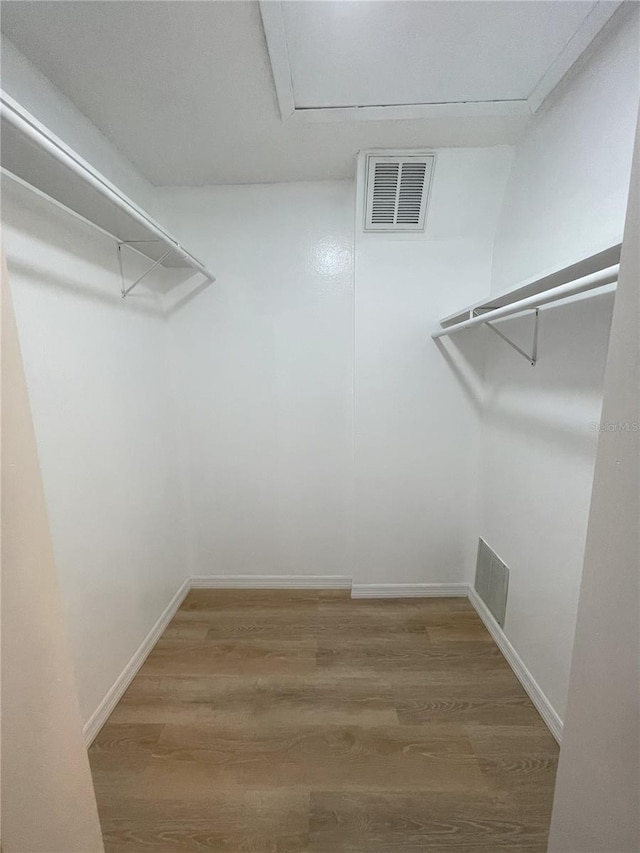 3007 Wainwright Ct, New Port Richey, FL 34655 - spacious closet featuring wood finished floors