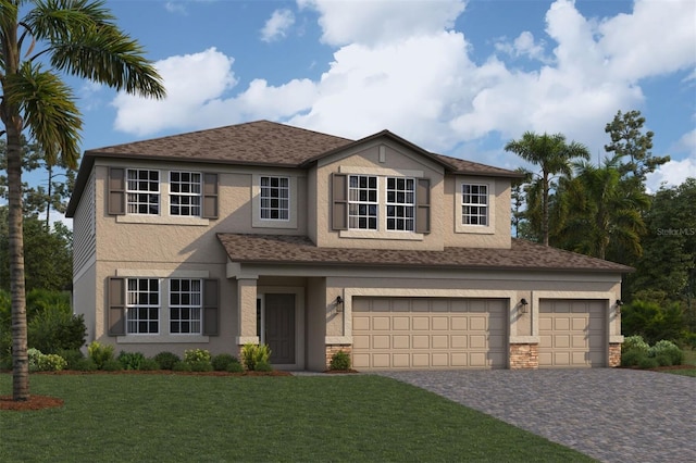 traditional-style home with stucco siding, decorative driveway, a front lawn, an attached garage, and a shingled roof