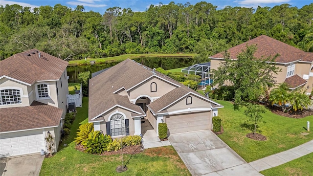 12510 Loquat Way, Tampa, FL 33626 - view of front of home featuring stucco siding, driveway, a garage, a front lawn, and a lanai
