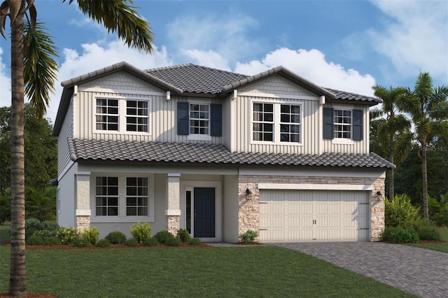 view of front of home with stone siding, board and batten siding, a garage, driveway, and a front yard