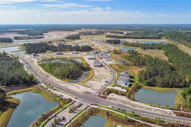 aerial view of property's location with a nearby body of water