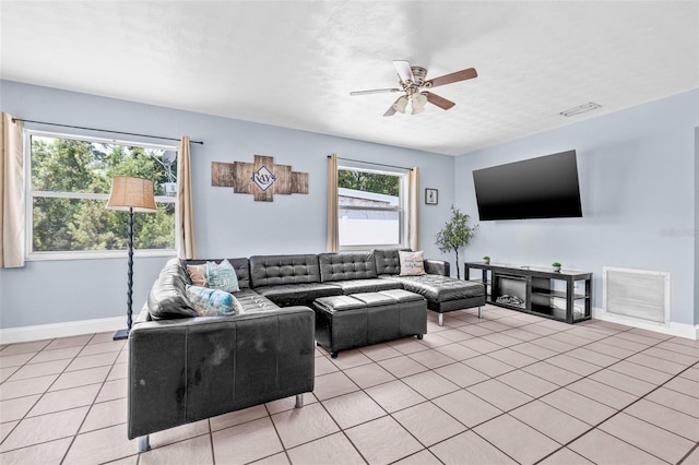 2861 Pinellas Point Dr S, Saint Petersburg, FL 33712 - living room with light tile patterned floors, baseboards, and ceiling fan