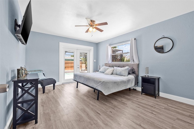 2861 Pinellas Point Dr S, Saint Petersburg, FL 33712 - bedroom with access to exterior, light wood-style floors, baseboards, a ceiling fan, and french doors
