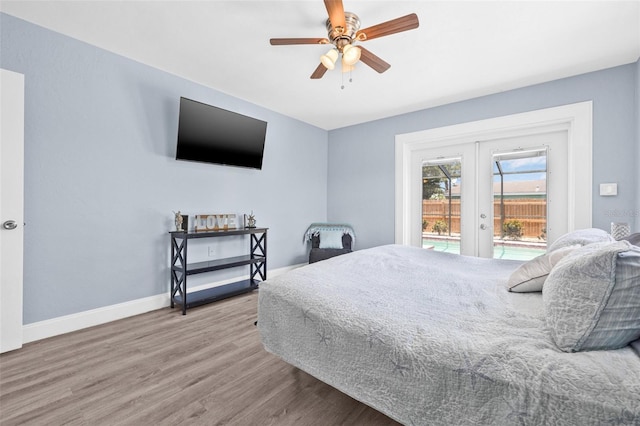 2861 Pinellas Point Dr S, Saint Petersburg, FL 33712 - bedroom with access to exterior, french doors, wood finished floors, baseboards, and a ceiling fan