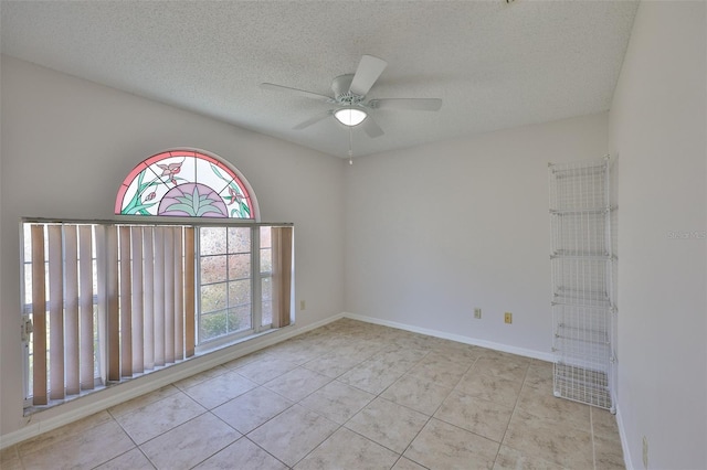 2021 Elk Spring Dr, Brandon, FL 33511 - spare room featuring tile patterned floors, a ceiling fan, a textured ceiling, and baseboards