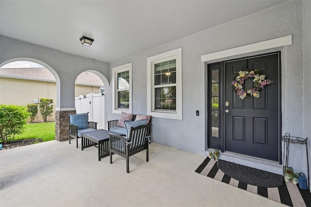 4151 Little Gap Loop, Ellenton, FL 34222 - view of exterior entry with stucco siding and a patio