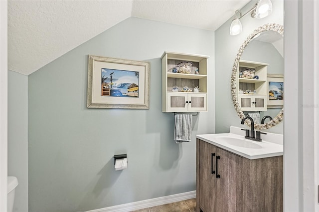 4151 Little Gap Loop, Ellenton, FL 34222 - half bathroom with vanity, a textured ceiling, and vaulted ceiling