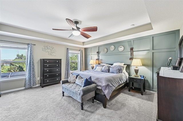 4151 Little Gap Loop, Ellenton, FL 34222 - carpeted bedroom with a tray ceiling and ceiling fan
