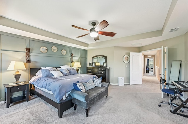 4151 Little Gap Loop, Ellenton, FL 34222 - bedroom with light colored carpet, a tray ceiling, and a ceiling fan