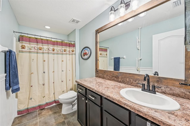 4151 Little Gap Loop, Ellenton, FL 34222 - full bath featuring vanity, tile patterned flooring, a shower with shower curtain, and a textured ceiling