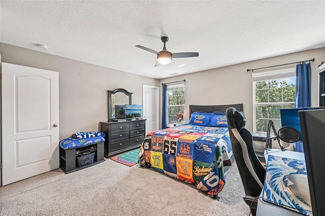 4151 Little Gap Loop, Ellenton, FL 34222 - bedroom featuring multiple windows, carpet floors, a textured ceiling, and ceiling fan