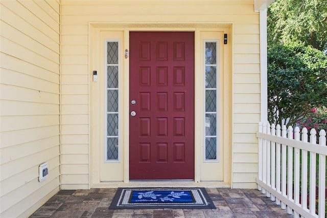 346 Gray Oak Dr, Tarpon Springs, FL 34689 - view of exterior entry featuring uncovered parking