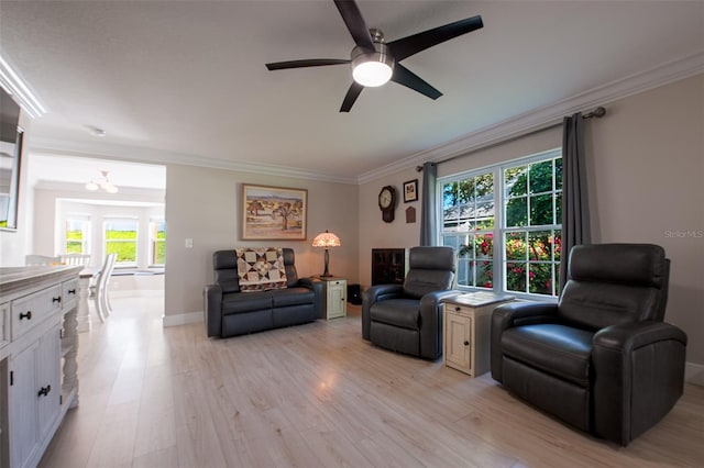 346 Gray Oak Dr, Tarpon Springs, FL 34689 - living area featuring ornamental molding, ceiling fan, light wood-type flooring, plenty of natural light, and baseboards