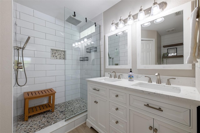 346 Gray Oak Dr, Tarpon Springs, FL 34689 - bathroom featuring double vanity, walk in shower, and wood finished floors