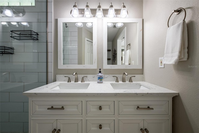 346 Gray Oak Dr, Tarpon Springs, FL 34689 - bathroom featuring double vanity and a textured wall
