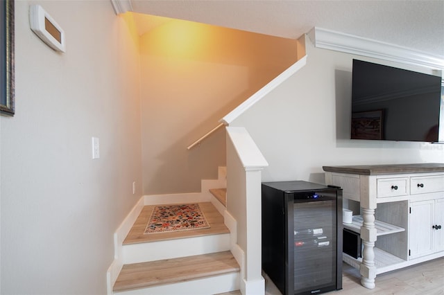 346 Gray Oak Dr, Tarpon Springs, FL 34689 - stairway with beverage cooler and wood finished floors