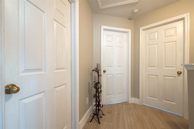 346 Gray Oak Dr, Tarpon Springs, FL 34689 - entryway with baseboards and light wood finished floors