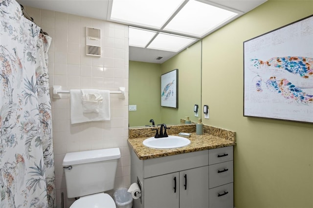 4510 Gulf Blvd Unit 604, St Pete Beach, FL 33706 - bathroom with vanity, tile walls, and a shower with shower curtain