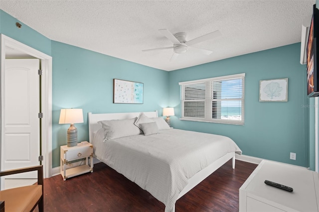 4510 Gulf Blvd Unit 604, St Pete Beach, FL 33706 - bedroom with wood finished floors, a textured ceiling, and ceiling fan