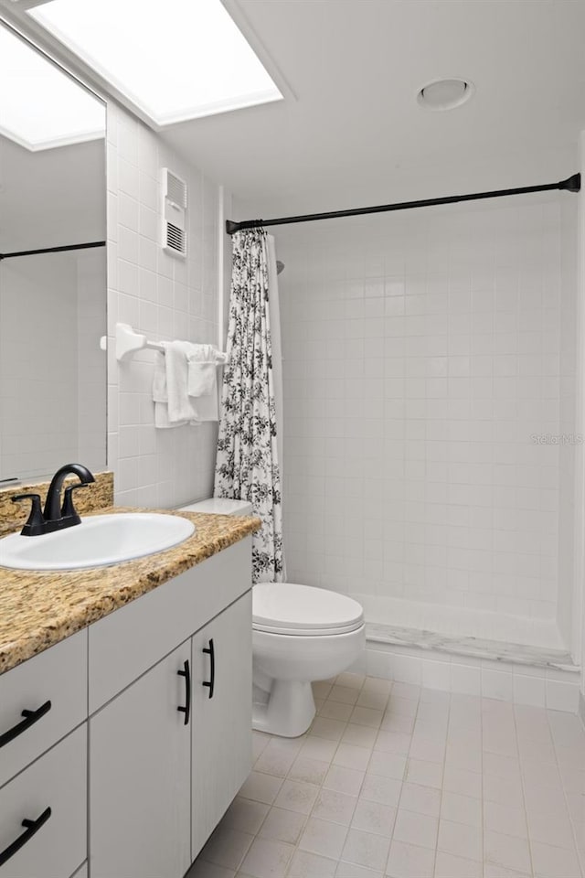 4510 Gulf Blvd Unit 604, St Pete Beach, FL 33706 - full bath featuring vanity, tile patterned flooring, tiled shower, and tile walls