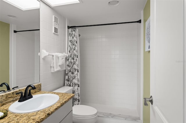 4510 Gulf Blvd Unit 604, St Pete Beach, FL 33706 - full bath featuring vanity, a tile shower, tile walls, and a skylight