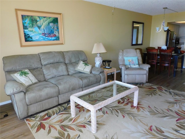 9 Forbes Pl Unit 310, Dunedin, FL 34698 - living area featuring wood finished floors and a textured ceiling