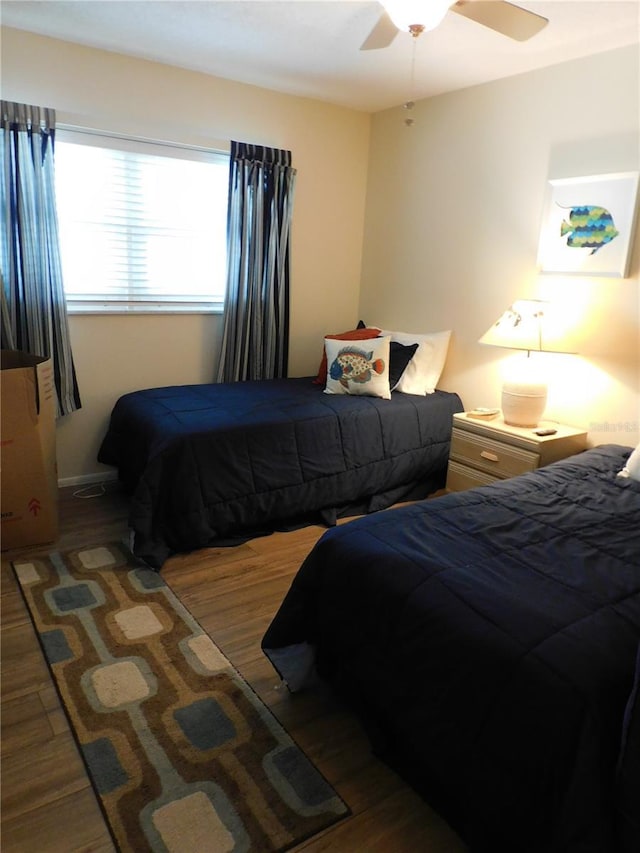 9 Forbes Pl Unit 310, Dunedin, FL 34698 - bedroom featuring wood finished floors and a ceiling fan
