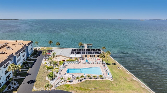 9 Forbes Pl Unit 310, Dunedin, FL 34698 - drone / aerial view of a pool area and a large body of water