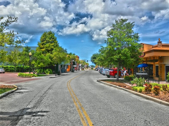 9 Forbes Pl Unit 310, Dunedin, FL 34698 - view of asphalt road with street lights and curbs