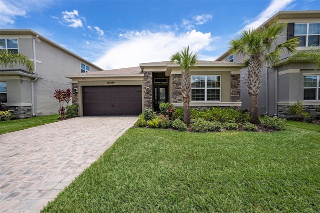 3318 Woodland Brook Way, Wesley Chapel, FL 33543 - view of front of property with stone siding, a garage, a front yard, decorative driveway, and stucco siding