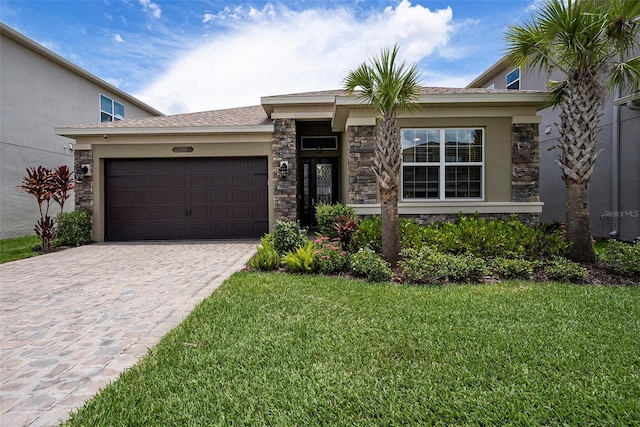 3318 Woodland Brook Way, Wesley Chapel, FL 33543 - view of front of house with stone siding, a garage, decorative driveway, and a front yard