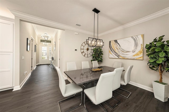 3318 Woodland Brook Way, Wesley Chapel, FL 33543 - dining space featuring dark wood-style floors, a chandelier, and crown molding