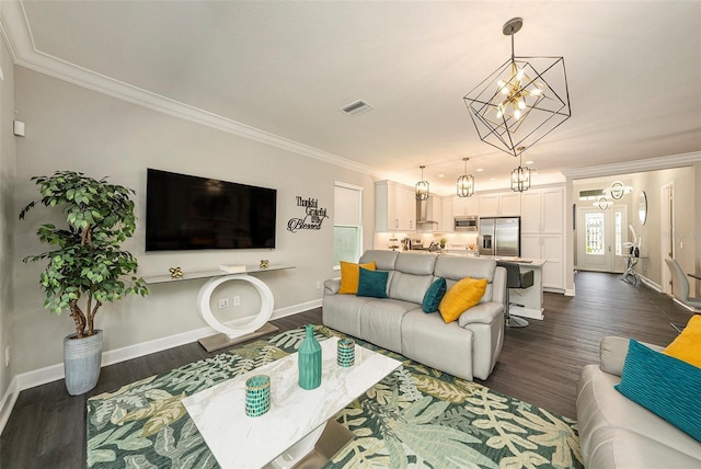 3318 Woodland Brook Way, Wesley Chapel, FL 33543 - living room featuring a chandelier, crown molding, and dark wood-type flooring