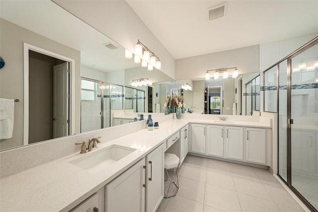 3318 Woodland Brook Way, Wesley Chapel, FL 33543 - full bathroom featuring double vanity, a stall shower, and tile patterned flooring