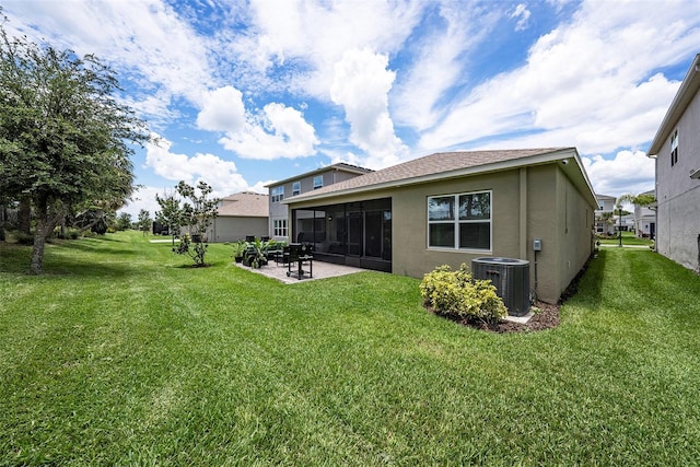3318 Woodland Brook Way, Wesley Chapel, FL 33543 - rear view of property with stucco siding, a lawn, a patio area, and a sunroom