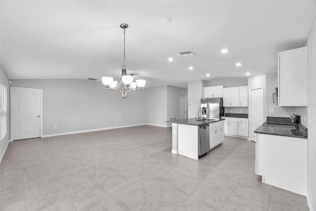 12907 Wildflower Meadow Dr, Riverview, FL 33579 - kitchen with stainless steel appliances, a sink, open floor plan, an island with sink, and a chandelier
